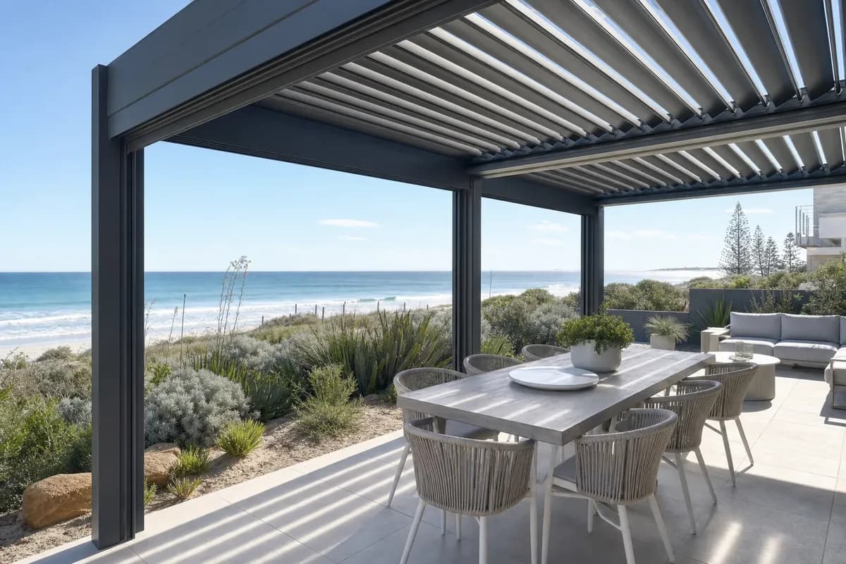 Flat-roof steel pergola over a paved alfresco at a beachside Perth home near Scarborough