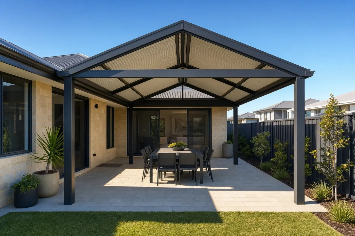 Attached steel pergola over a paved alfresco at an inland northern-suburbs home in Wanneroo